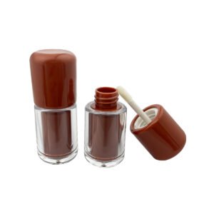 Mini Lip Gloss Tube – a short transparent cylindrical body is paired with a rounded brown cap