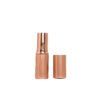 st-ls-001-03 The appearance of a rose gold striped lipstick tube when its cap is being opened.