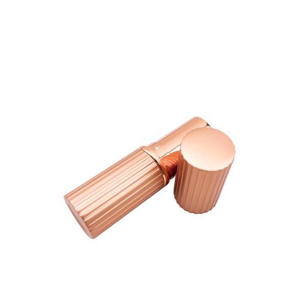 st-ls-001-05 The appearance of a rose gold striped lipstick tube when its cap is being opened.