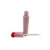 st-ls-007-03 Separated view of pink lip gloss bottle with gradient red heart cap and white applicator wand