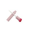 st-ls-007-05 Diagonal view of empty lip gloss container, pink cylinder bottle with gradient heart cap