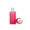 Separated view of pink frosted lip gloss bottle with gold oval cap, empty lip gloss packaging