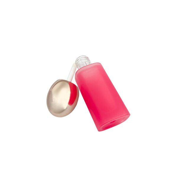 Tilted view of frosted pink lip gloss case, square empty lip gloss tube with gold egg cap