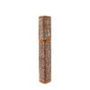 Closed hexagonal empty mascara tube, full vertical shot with crocodile pattern PU leather and rose gold trim