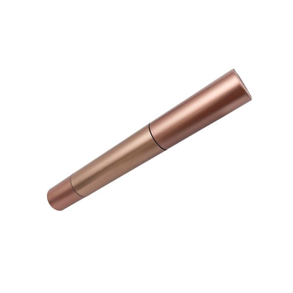 1. Side angled shot of closed rose gold matte straight cylinder empty mascara packaging