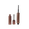 Disassembled view of rose gold matte empty mascara tube, separated bottle, cap and extended spiral brush