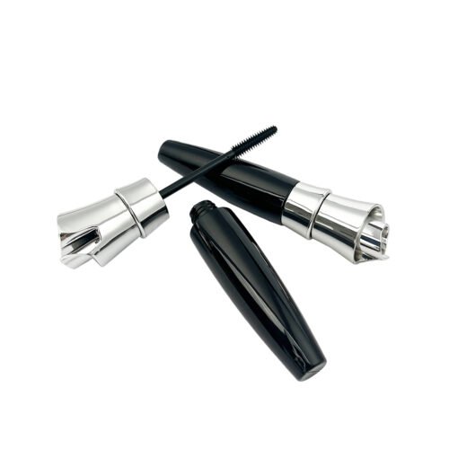 Multiple empty mascara packaging components display, cosmetic mascara tube set white background