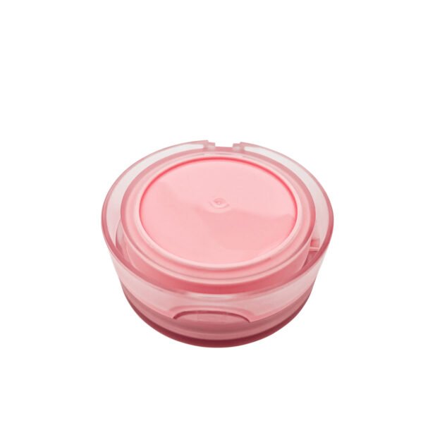 Top-down view of closed frosted translucent pink round cosmetic powder compact
