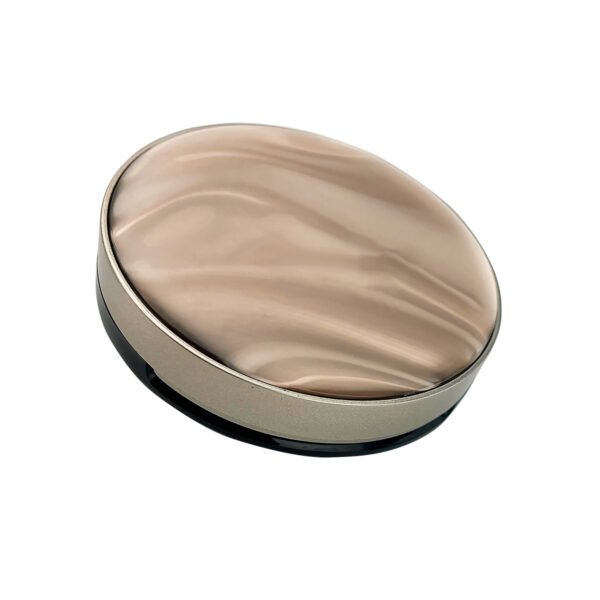 Front view of closed round powder compact with brown marble pattern cap